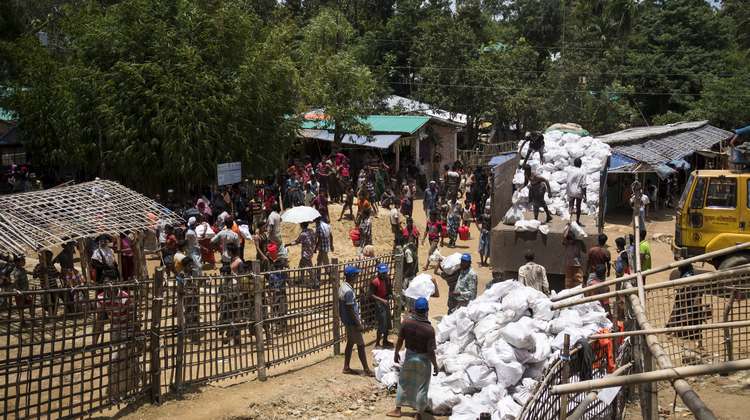 Hakimpara refugee camp in Bangladesh: Local NGO FIVDB distributes sacks with charcoal and rice husk pellets to Rohingya refugees (August 2018).