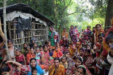 Women assemble in their village in West Bengal, India.