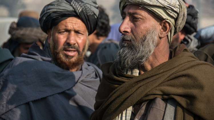 Janaan (right), age 40, fled to Kabul with his family. They live in an informal slum and benefit from Welthungerhilfe efforts.)