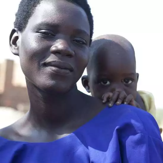 A woman who returns to her destroyed village in Uganda after years of flight.