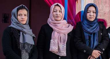 Graduates of Welthungerhilfe's vocational training programme in fron of their own business in Kabul