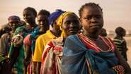 Women queuing in the early morning to receive food in the Bentiu refugee camp in South Sudan