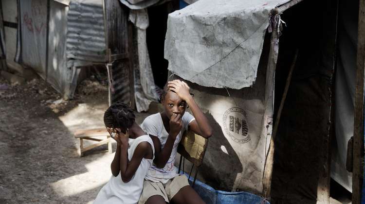 Two sisters in a tent camp for people who have lost their house in an earthquake (Haiti 2013)