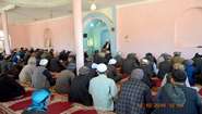 Religious leader speaks to men at mosque in Afghanistan
