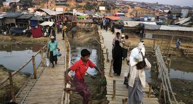 Two bamboo bridges leading over a river in the Kutupalong camp for Rohingya refugees in Bangladesh