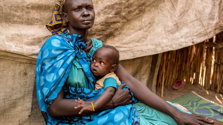 Nyaphini with her baby at the refugee camp Bentiu. She had to flee the violence in South Sudan with her family.