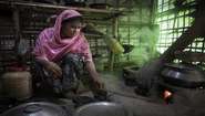 Rohingya woman Mostafa B. is cooking a meal in camp Hakimpara, Bangladesh. 