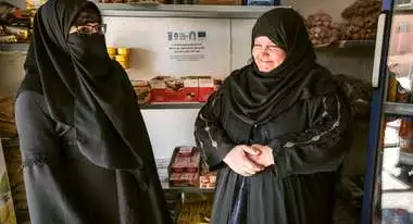 Salima and her sister Saliha stand in their newly opened shop in Al-Baghdadi, Anbar.