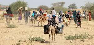 Sudanese refugees who have fled the violence in the Darfur region seek temporary refuge in Goungour, Chad.
