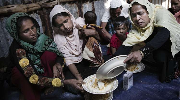 A group of Rohingya refugees in the Cox's Bazar district of Bangladesh have received food from the local population.