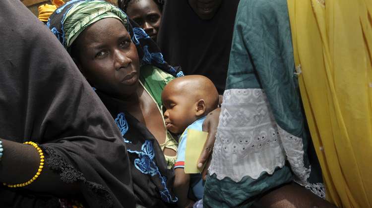 A mother with her baby in the Kayes region, Mali (2012).