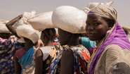 Women are waiting at a food distribution centre at the refugee camp in Bentiu, Southern Sudan.