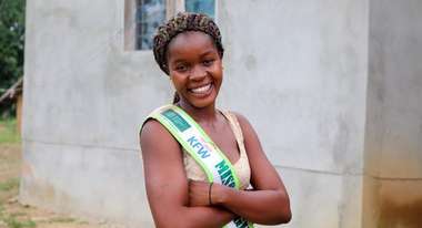 The proud smile gives it away: Pauline likes being Miss Hygiene. WASH topics are close to her heart.
