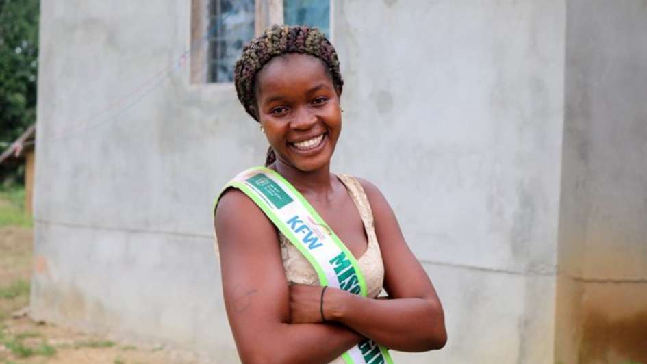 The proud smile gives it away: Pauline likes being Miss Hygiene. WASH topics are close to her heart.