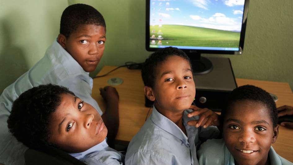 Schoolchildren using a computer room