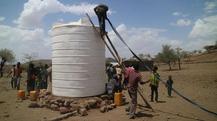 Lorries transport the huge water tanks to dry areas for use by the residents.