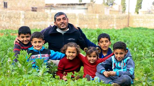 Amar Homede, 35, with his children