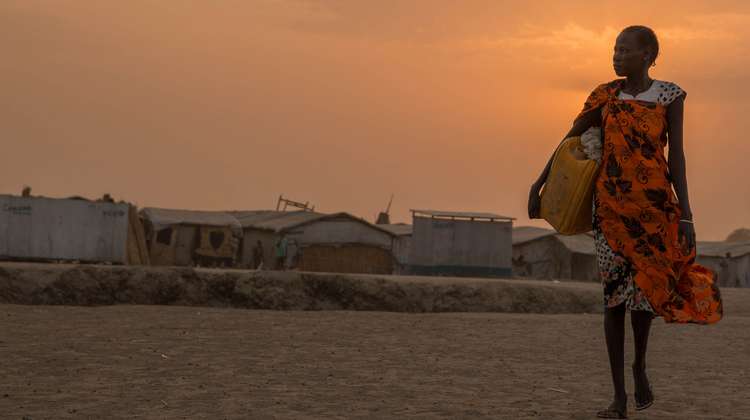 A woman on her way to get water in a refugee camp in Bentiu, South Sudan