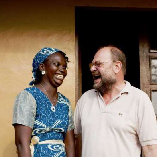 Press trip to Sierra Leone. Antoinette Saffa (Chief Accountant) and Franz Moestl (Project Manager) in front of their office. © World Hunger Aid