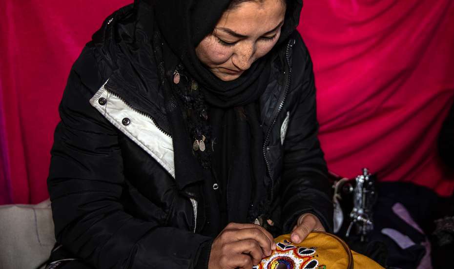 Shahnoz doing embroidery